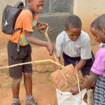 forever-friends-of-uganda-sponsored-children-cleaning-up.jpg